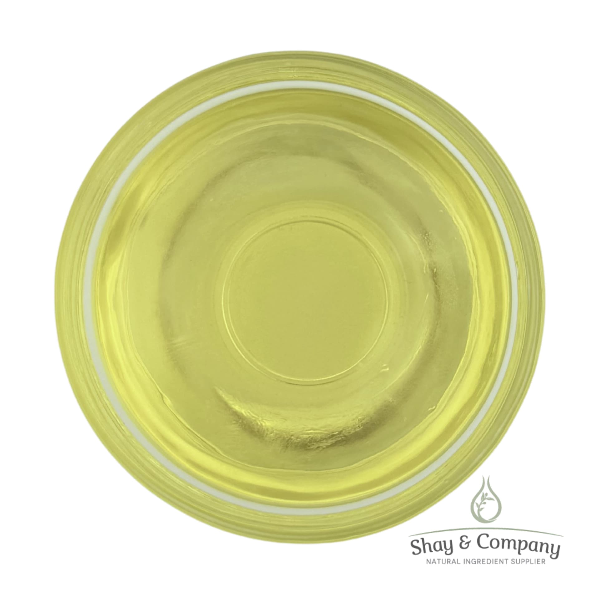 Top-down view of pale yellow carrier oil in a glass dish from Shay & Company Natural Ingredient Supplier.