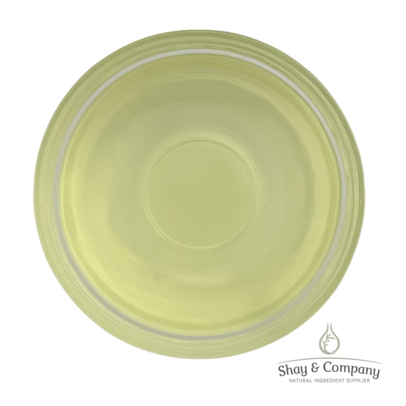 Pale yellow-green circular cosmetic or skincare product in a clear container with Shay & Company branding.