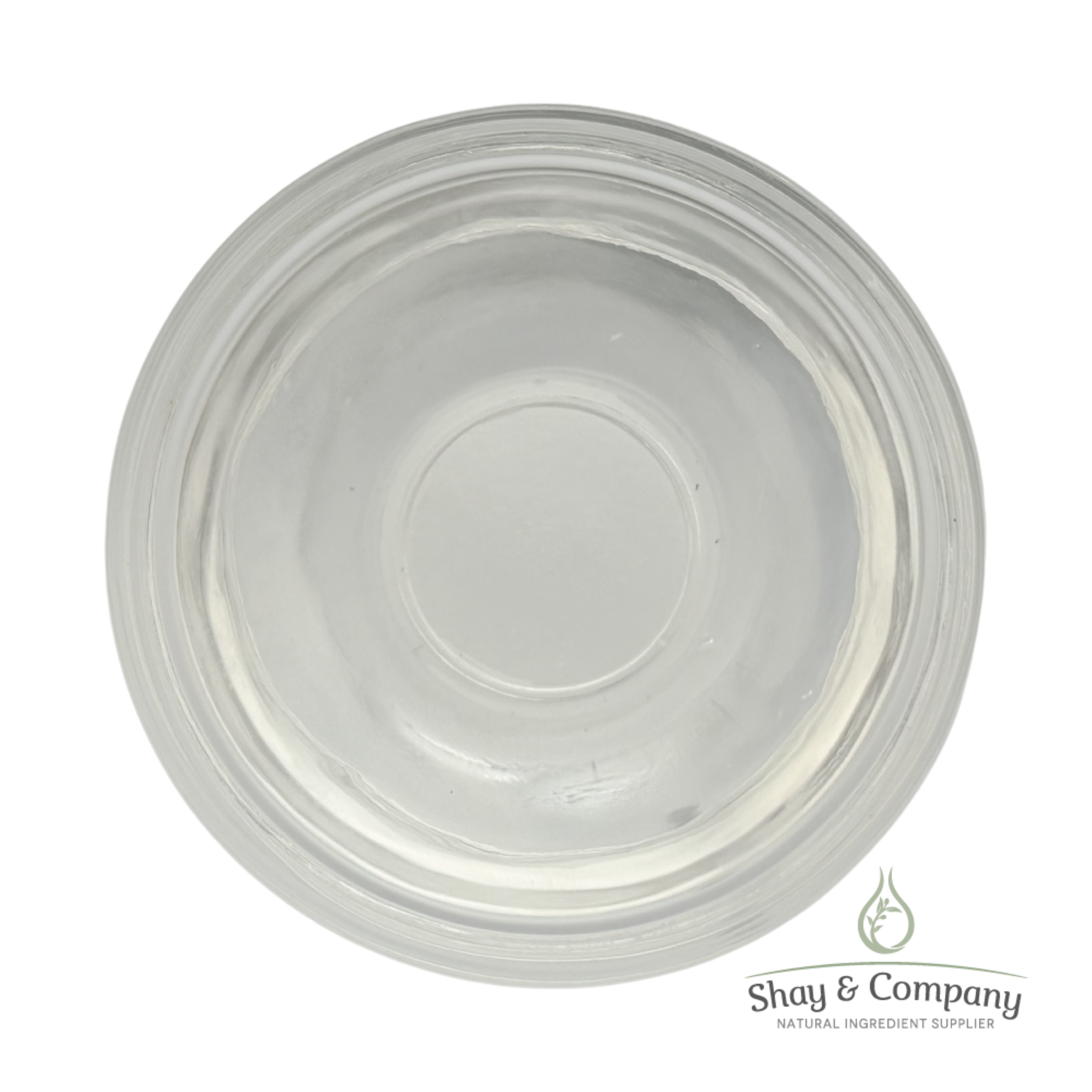 Clear glass jar with concentric circular ridges viewed from above, Shay & Company logo visible.