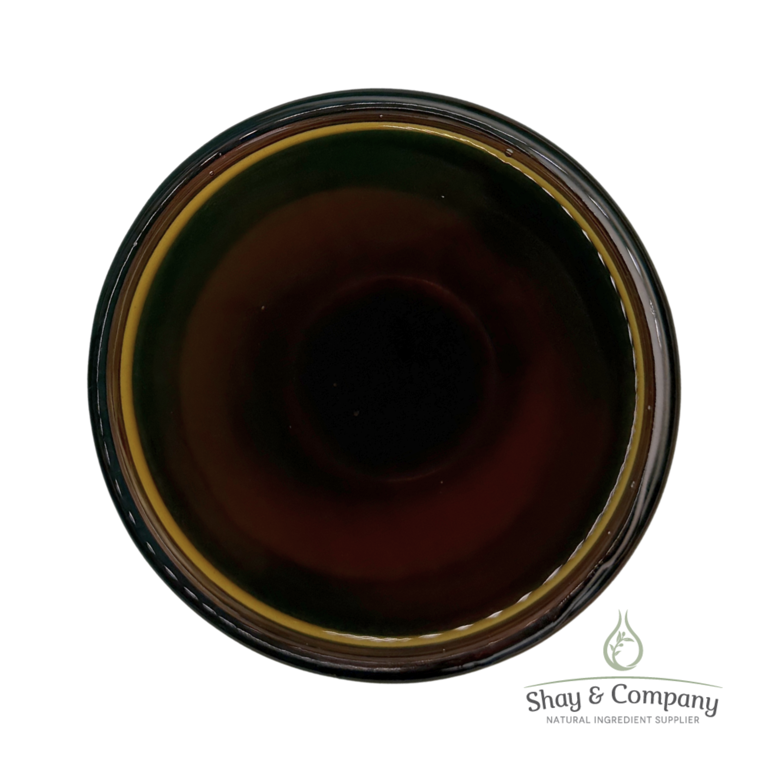Dark amber liquid in glass jar with gold rim and black lid from Shay & Company natural ingredient supplier.
