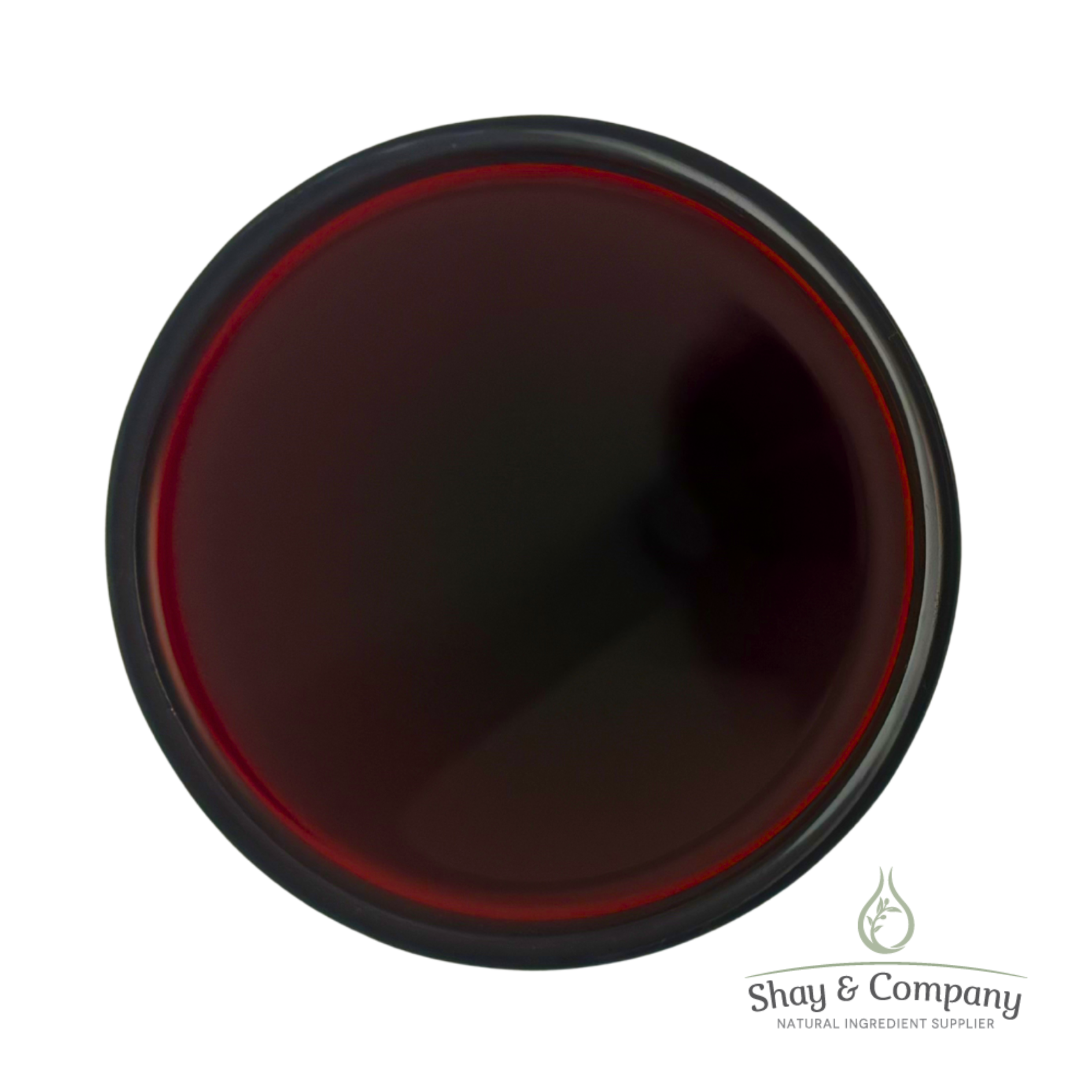 Dark red liquid in black-rimmed container from Shay & Company natural ingredient supplier.
