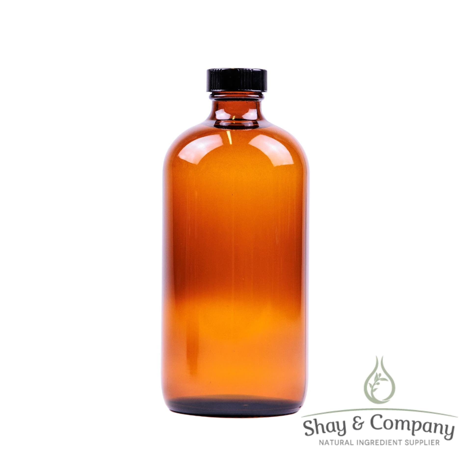 Amber glass bottle with black cap from Shay & Company natural ingredient supplier on white background.