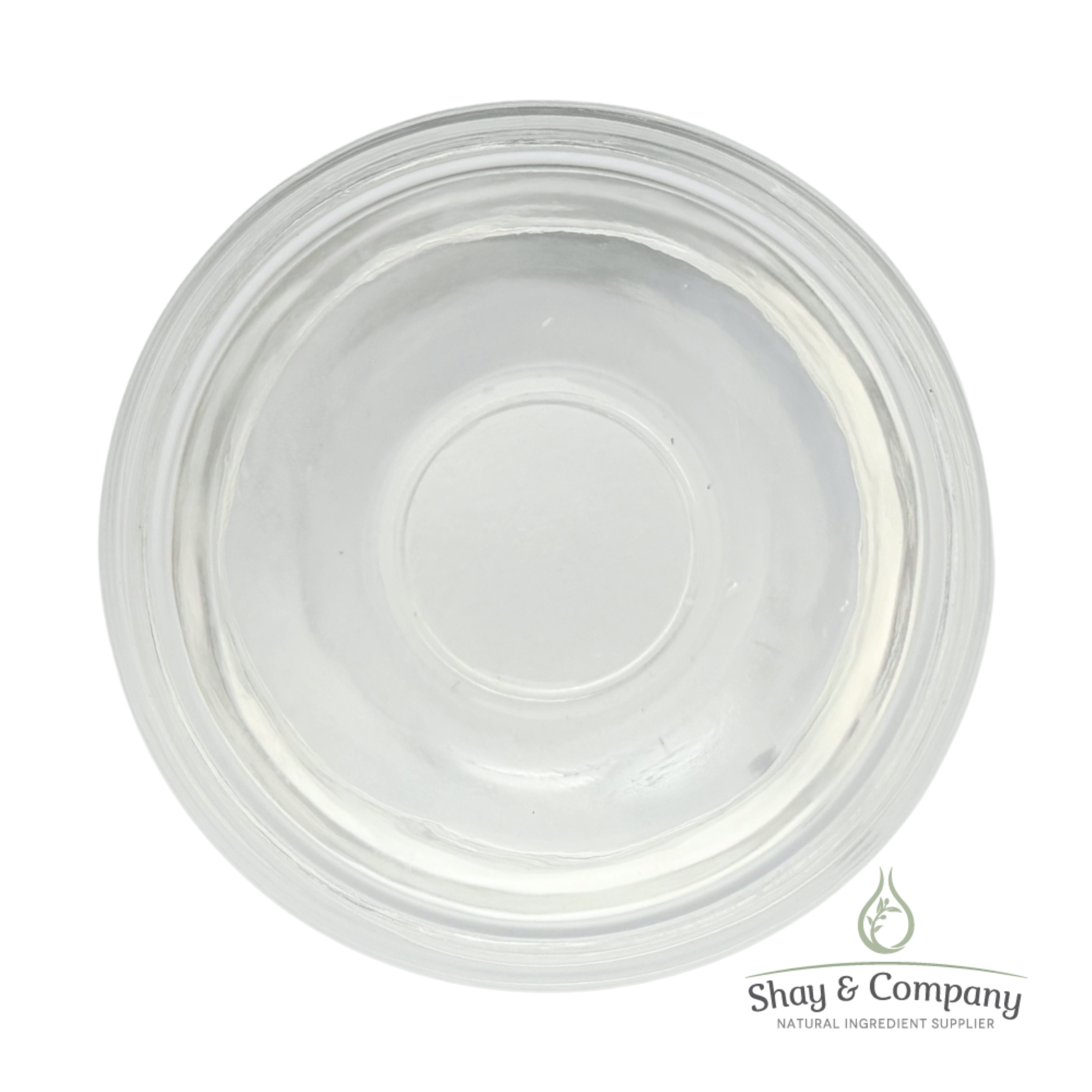 Empty clear plastic container with concentric circular rings viewed from above, Shay & Company logo.