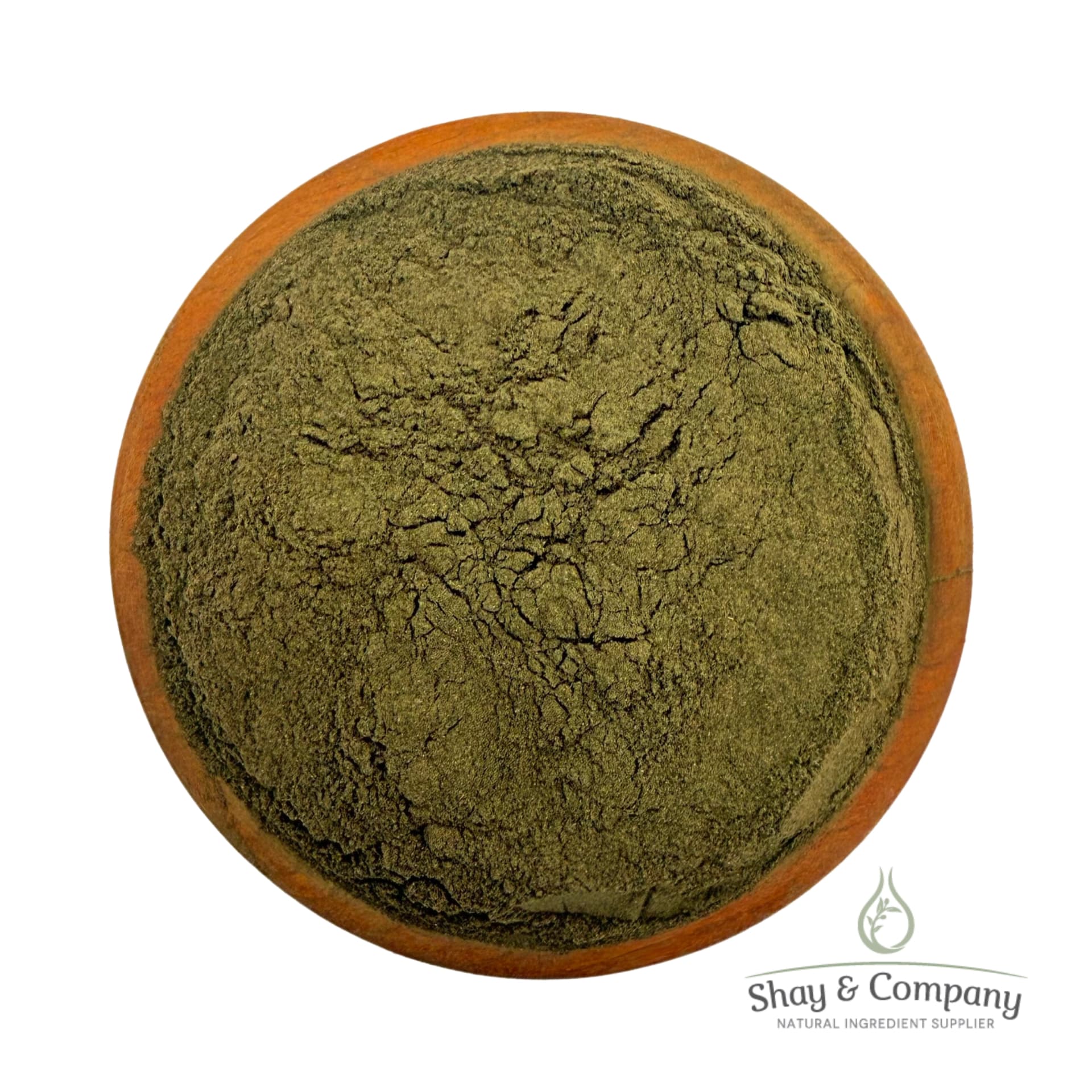 Finely ground green herb powder in a wooden bowl from Shay & Company natural ingredient supplier.