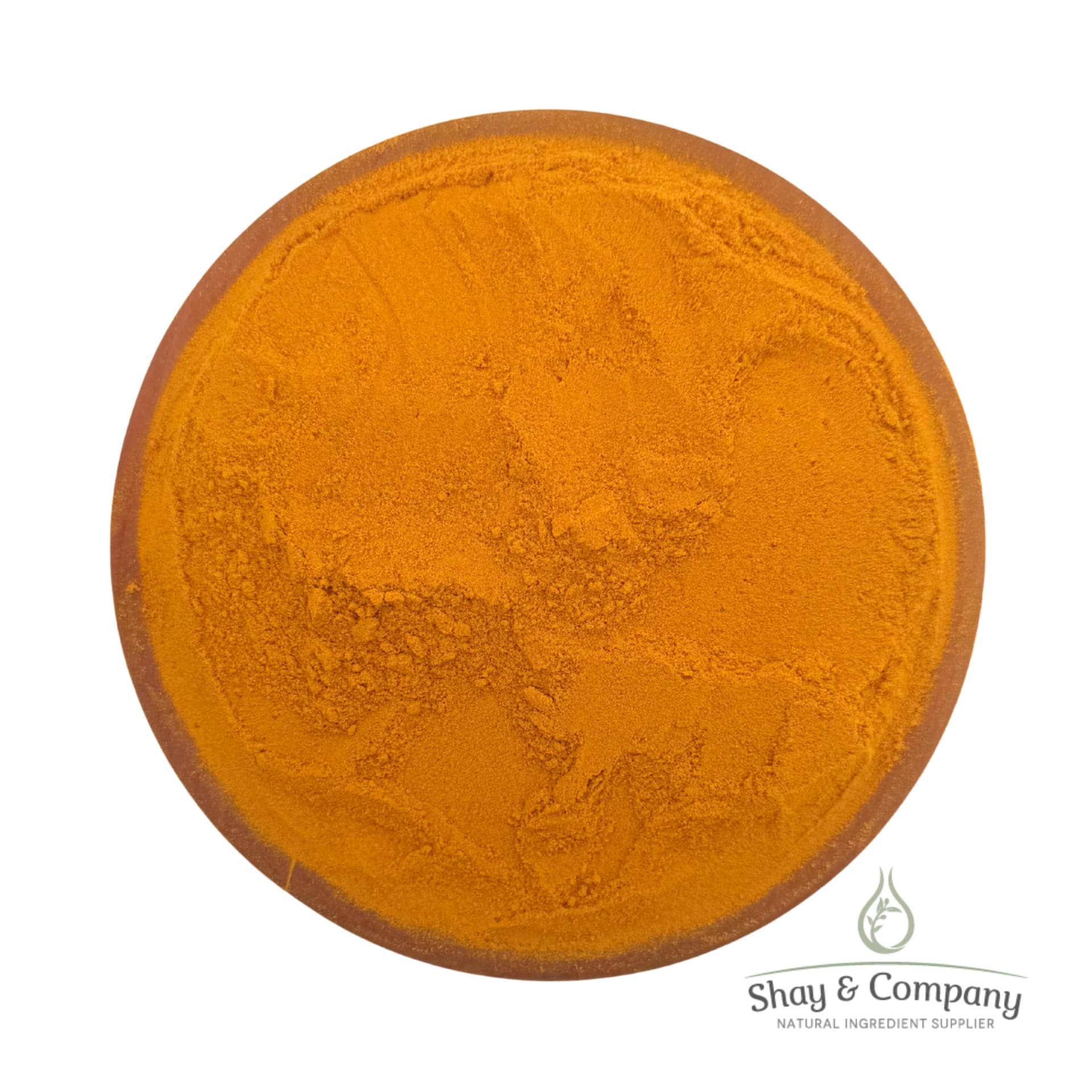 Turmeric powder in a clay bowl from Shay & Company natural ingredient supplier.