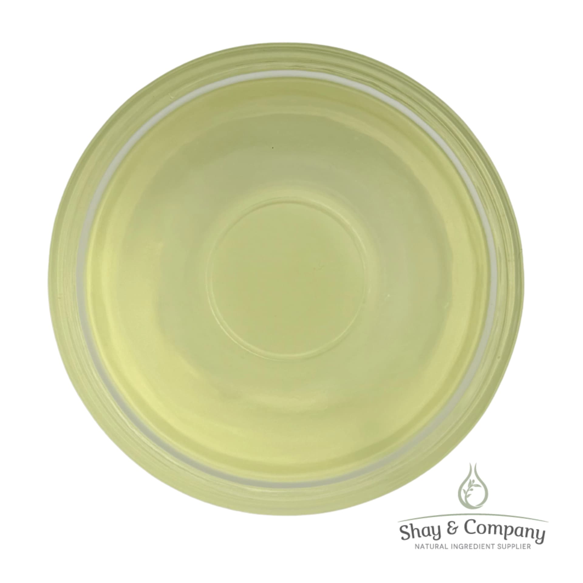 Pale yellow-green circular cosmetic or skincare product in a clear container with Shay & Company branding.