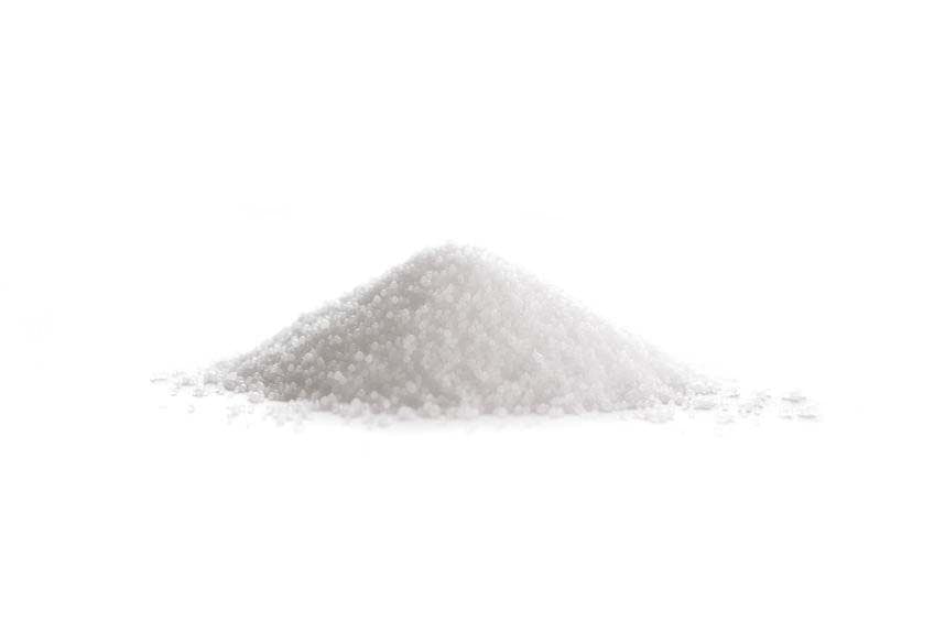 Pile of white granulated sugar isolated on a white background.