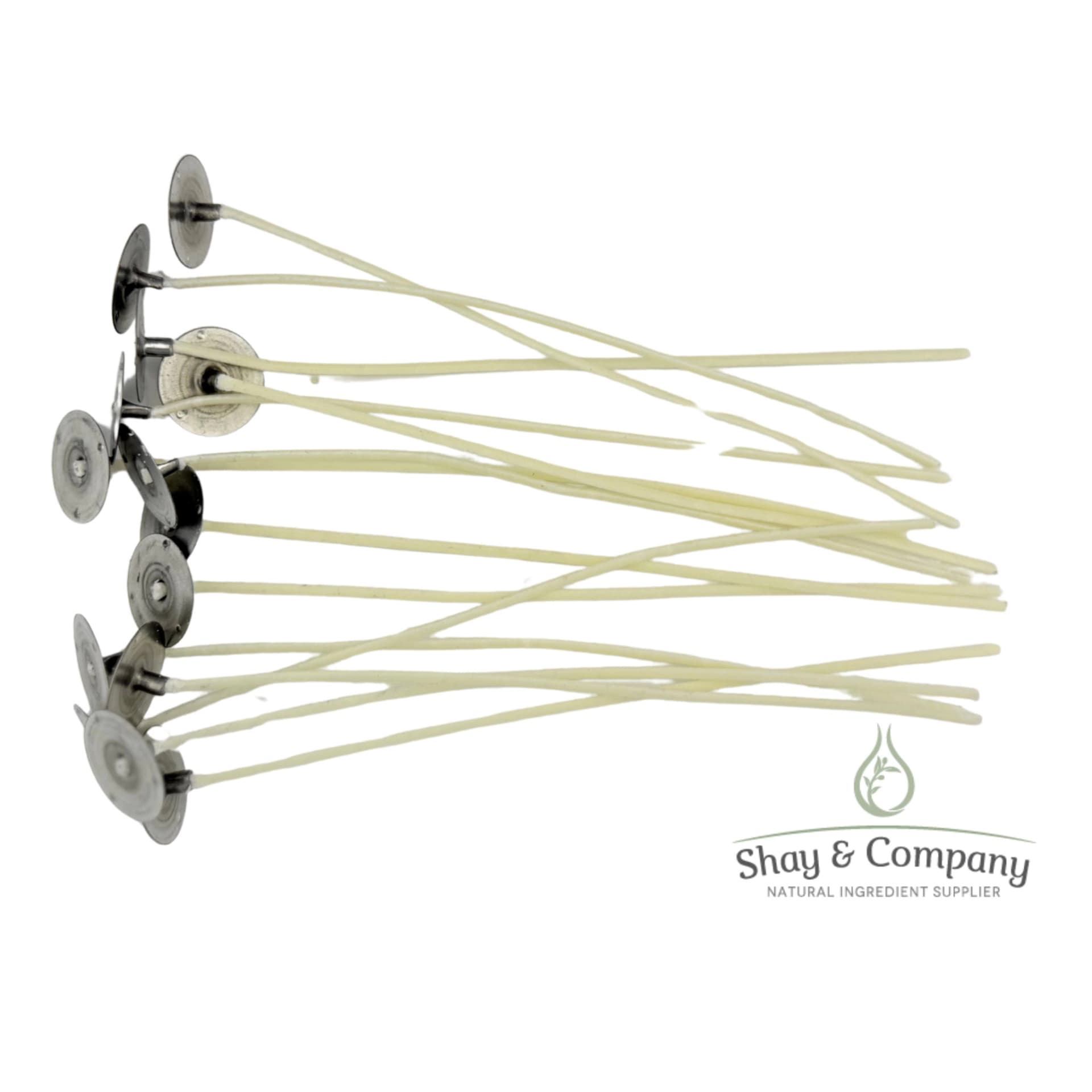 Shay & Company natural ingredient supplier logo with dried botanicals and metal applicator discs.